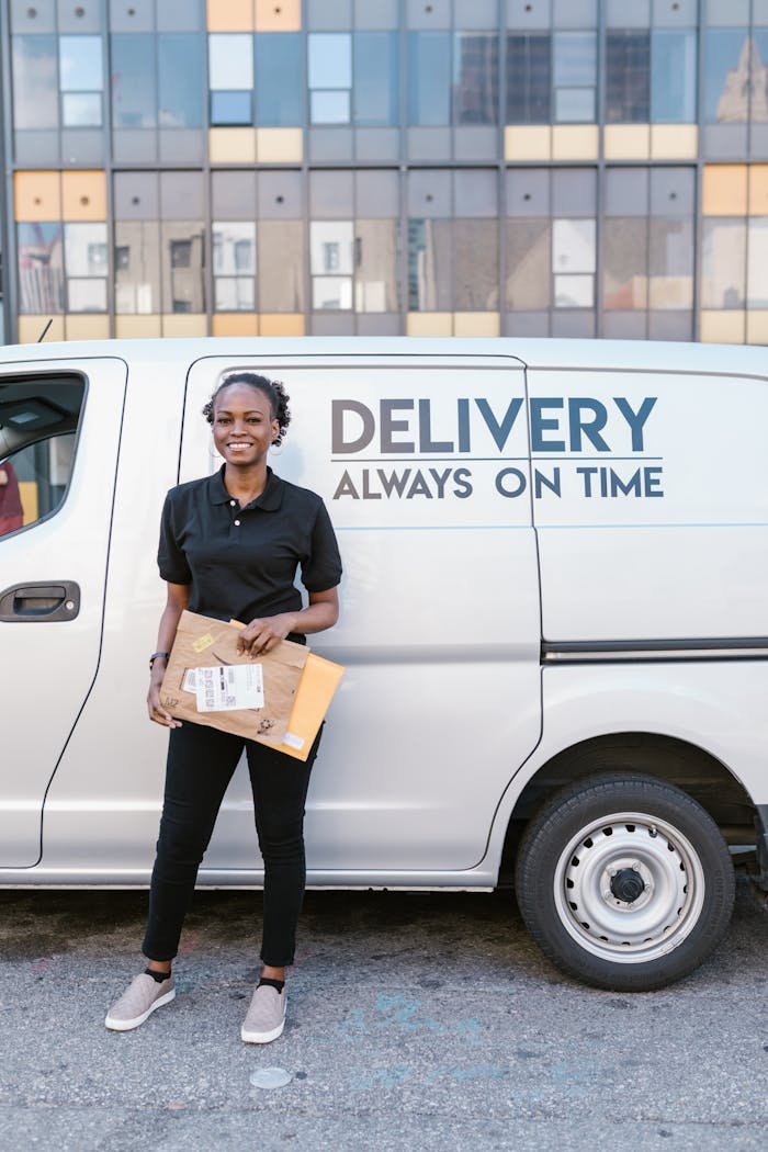 A Deliverywoman Holding Document Parcels